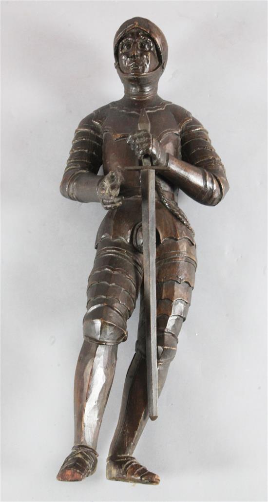 A 16th century Continental carved limewood figure of a knight, height 84cm